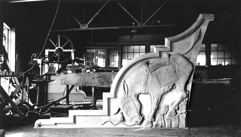 1937 Steinhauer Field House The architect who designed the Field House ("Steinhauer" was added to the name in 1949), incorporated a bucking burro and other imagery into the terra cotta castings placed at either end of the building. He was later asked to incorporate these into graphics for the school's first logo. (Photo: Russell & Lyn Wood Mining History Archive, Arthur Lakes Lib., CSM)