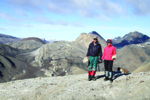 John Spear and Alexis Templeton hold samples of gypsum rock while standing on the gypsum diaper at Hare Fiord, Ellesmere Island, Canada.