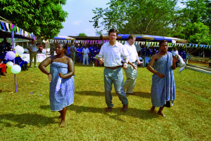 Bill Zisch gets a dance lesson from local residents during a community celebration in Ghana, West Africa. 