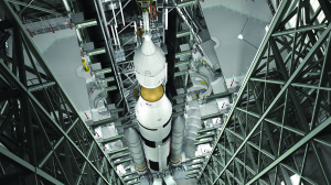 This artist?s rendering shows the Orion spacecraft ready for launch atop the Space Launch Systems Heavy Lift Rocket at Kennedy Space Center.