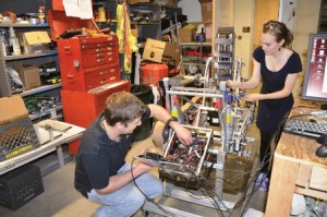 Blasterbotica team members Katie Kostecka '15 and David Long prepare the rover for the NASA Robotic Mining Competition held at Kennedy Space Center in May. (Laurie Schmidt)