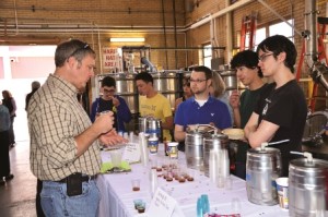 Students from the "Introduction to Brewing Science" class at Mines await the verdict as Pete Turner '90, MS '94 tastes the team's crafted beer. Turner is a manufacturing systems engineer and sensory panelist at MillerCoors. 
