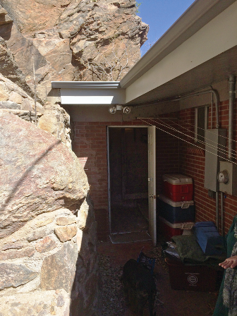 The house currently owned by Holly Bidle was built into the side of Mount Zion. Through this entrance and to the left is the tunnel leading into the mine that was once used by Mines students. (Courtesy of Holly Bidle)