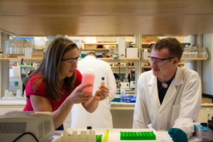 Jenifer Braley works with a student in the radiochemistry lab