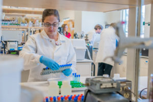 Female student works in the radiochemistry lab