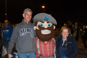 President Paul Johnson and wife Elyse with Marvin the Miner at Homecoming 2016