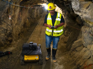 A student operates a robot inside Edgar Mine