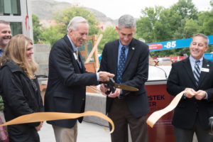 Joe Coors and Paul Johnson cutting the ribbon to open the CoorsTek Center