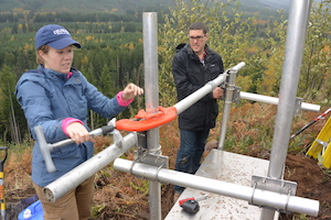 Rebecca Kramer '09 and a colleague construct an enclosure and solar panel frame for a remote monitoring station to detect lahars on Mt. Rainier.
