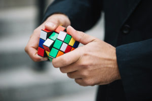 Hands holding Rubiks Cube
