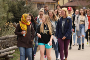 Group of female students walking on campus