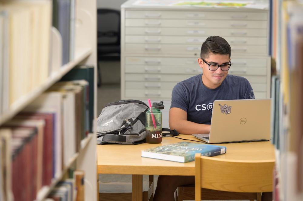Student studying with a laptop