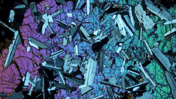 This thin section of a mafic rock, shown under cross- polarized light, came from the Duluth Complex, one of the worldâ€™s largest undeveloped deposits of copper, nickel and platinum metals.