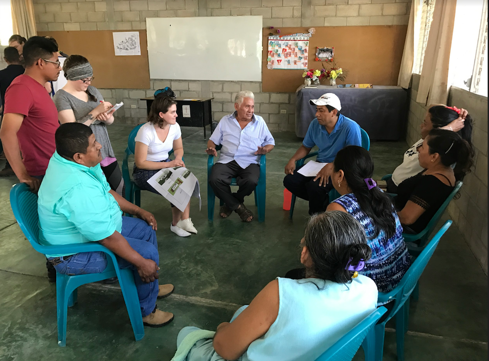 Mines students sit in a circle with Guatemalan locals