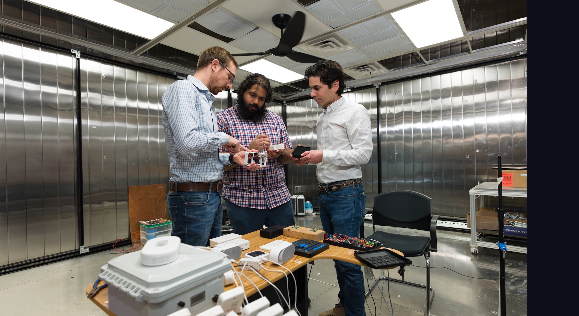 Paulo Cesar Tabares Velasco, Andy Gloor and Quin Guy with indoor air quality data acquisition system. This system is designed to measure temperature, relative humidity, particulate matter, CO2, and other gases. These units are deployed across multiple homes in Denver as well as rural mountain areas in Colorado.